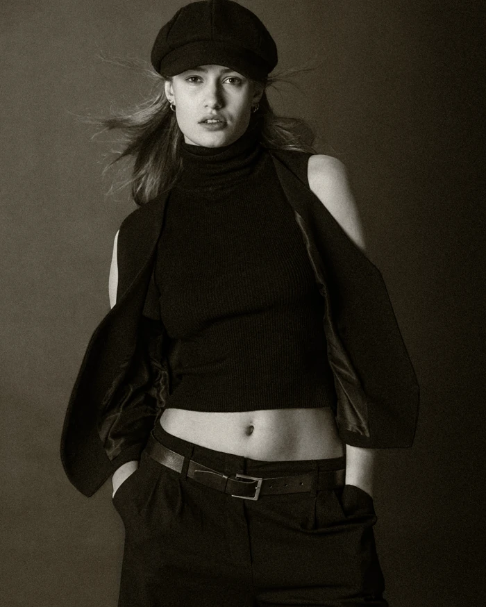 Black and white portrait of a woman wearing a cap