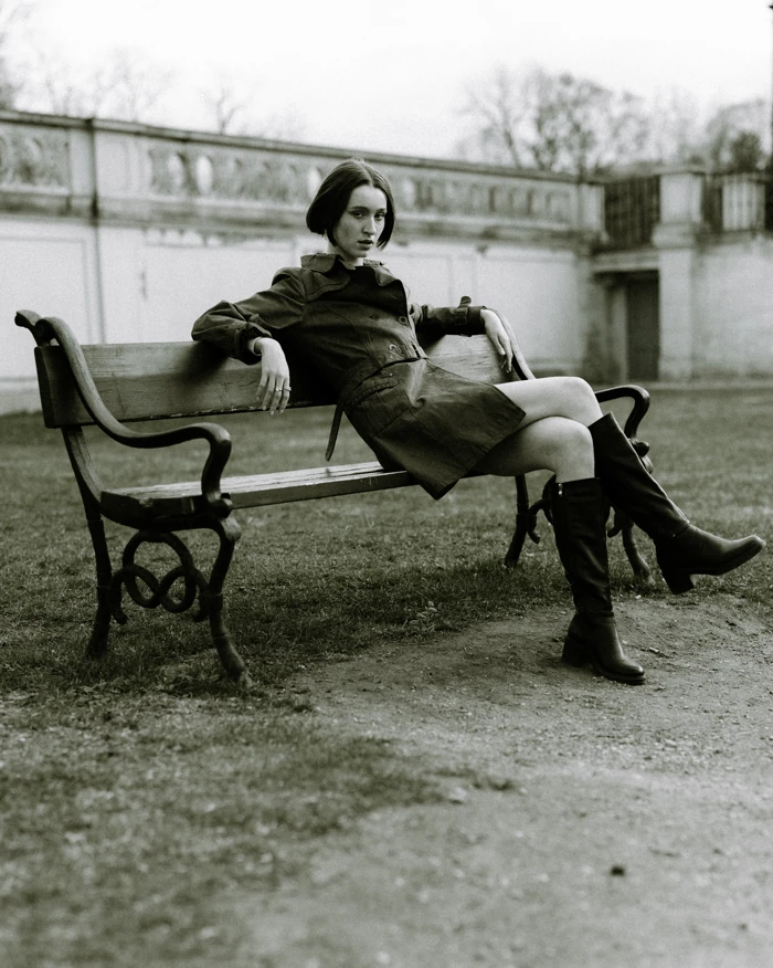 Woman seated on a bench outdoors